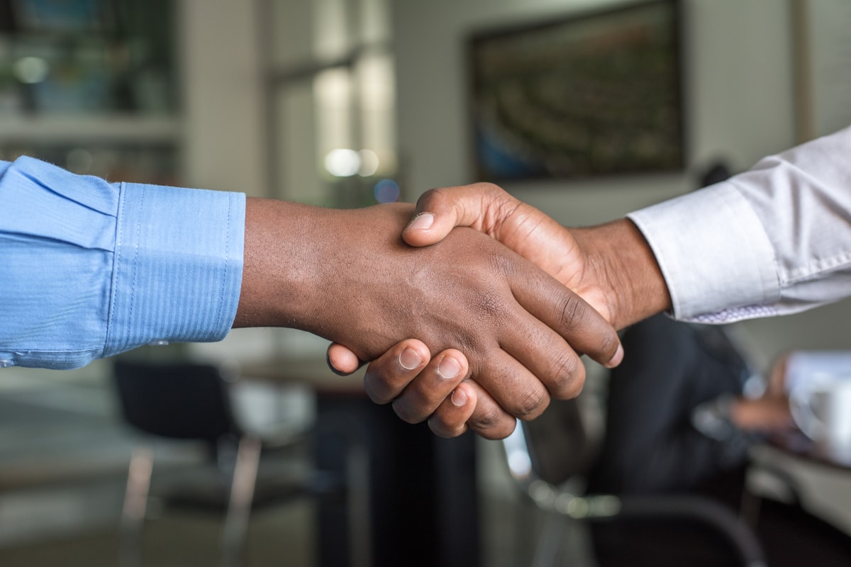 Loan advisor handshake at signing